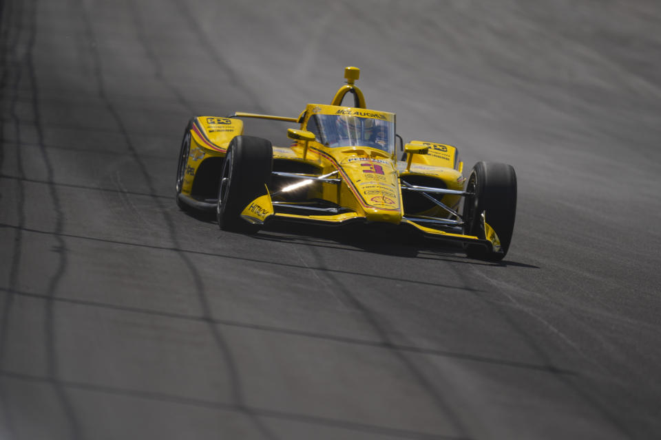 Scott McLaughlin, of New Zealand, drives into the Turn 2 during qualifying for the Indianapolis 500 auto race at Indianapolis Motor Speedway in Indianapolis, Sunday, May 19, 2024. (AP Photo/Michael Conroy)