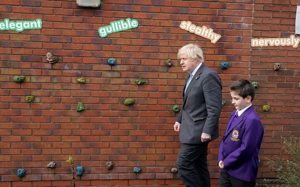 Stealthy: Boris Johnson snapped during today's visit to a school in Stoke-on-Trent - Getty