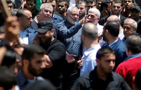Hamas Chief Haniyeh, Gaza's Hamas Chief Al-Sinwar, and other Palestinian factions' leaders take part in a protest against Bahrain's workshop for U.S. Middle East peace plan, in Gaza City
