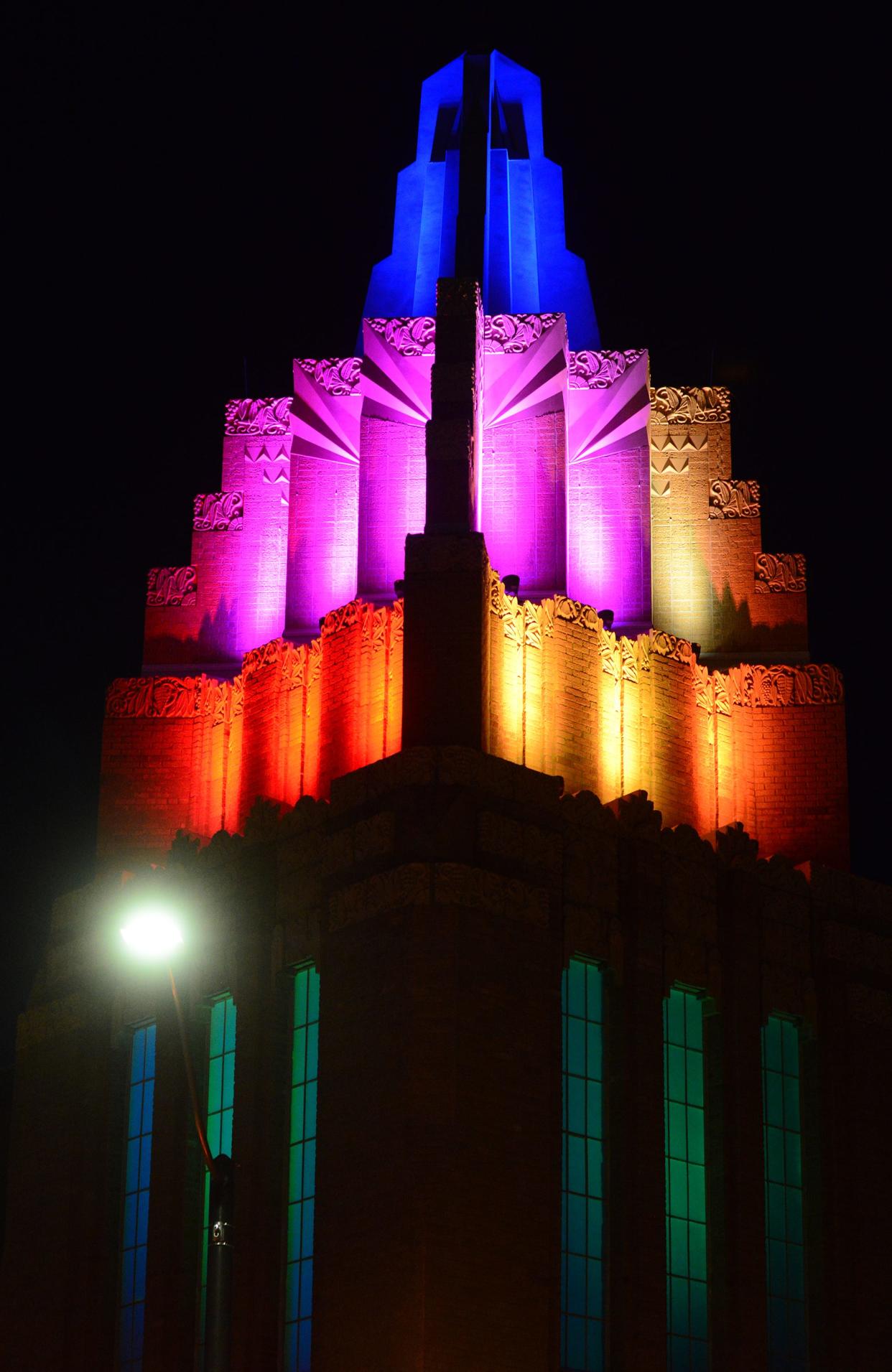 Multi-colored lights illuminated the newly restored tower and spire atop the The Stiefel Theatre in downtown Salina.