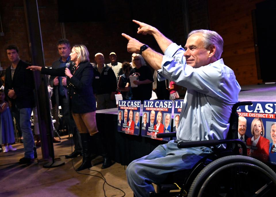 Gov. Greg Abbott points toward Liz Case as her campaign rally wraps up Tuesday. Case is challenging District 71 state Rep. Stan Lambert in next week’s Republic primary, Lambert is one of several state representatives targeted by Abbott who failed to pass the governor’s school voucher legislation in the last session.