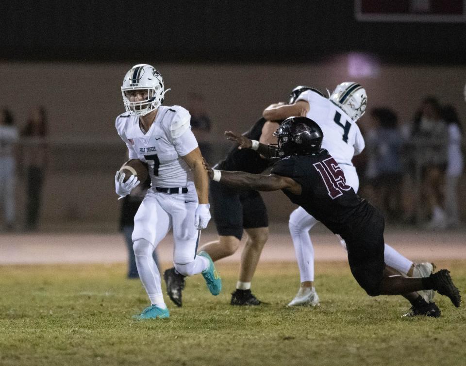 Bryson Rouillier (7) returns a kickoff during the Gulf Breeze vs Navarre football game at Navarre High School on Friday, Oct. 27, 2023.