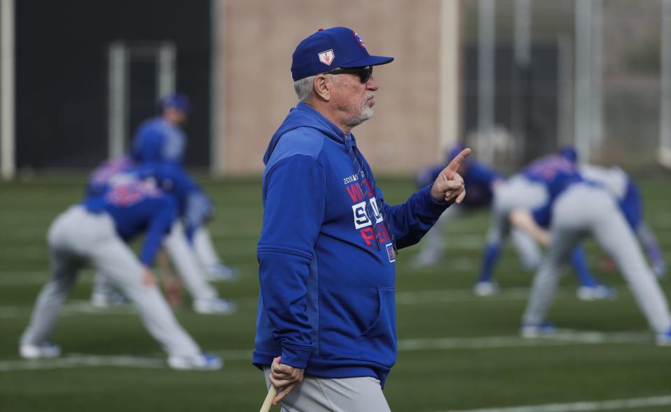 FILE - In this Feb. 15, 2019, file photo, Chicago Cubs manager Joe Maddon watches during a spring training baseball workout, in Mesa, Ariz. In the aftermath of Chicago’s collapse last season, Maddon went looking for a deeper understanding of the players who dominate the major leagues these days. Maddon’s search took him to “Managing Millennials for Dummies,” and the book reinforced what he already felt about the people he worked with every day. (AP Photo/Morry Gash, File)