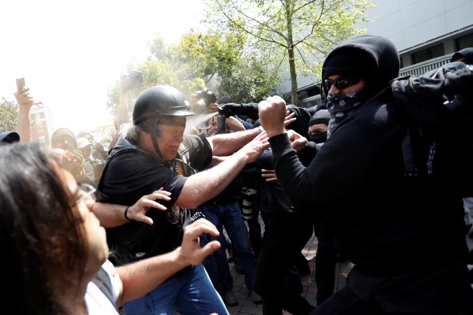 A man in support of U.S. President Donald Trump (L) is being pepper sprayed by a group on counter-protestors during a rally in Berkeley, California in Berkeley, California, U.S., April 15, 2017. REUTERS/Stephen Lam TPX IMAGES OF THE DAY