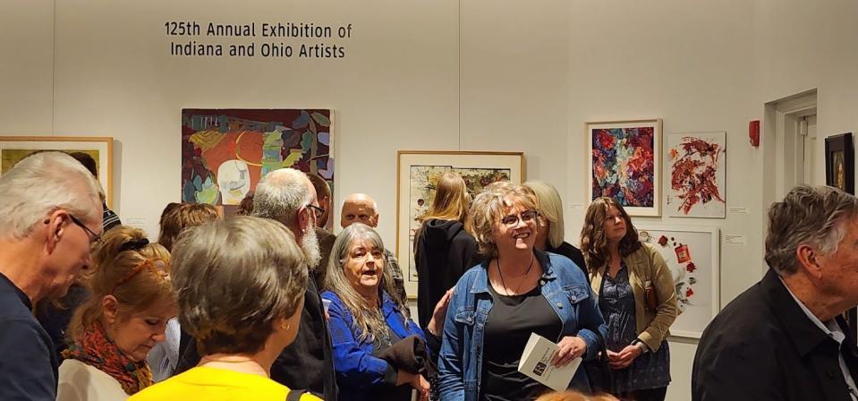 Attendees walk around the 125th Annual Exhibition of Indiana and Ohio Artists at the Richmond Art Museum, Thursday, Nov. 9, 2023.