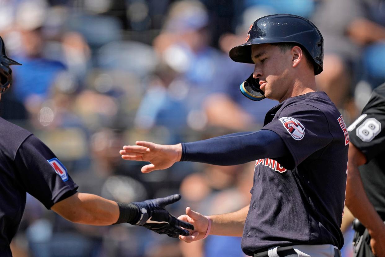 Cleveland Guardians' Will Brennan, right, celebrates with Steven Kwan after scoring on a sacrifice fly by Myles Straw during the second inning of a baseball game against the Kansas City Royals Monday, Sept. 18, 2023, in Kansas City, Mo. (AP Photo/Charlie Riedel)