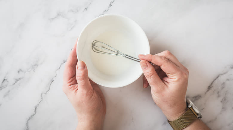 whisking cornstarch and water in bowl