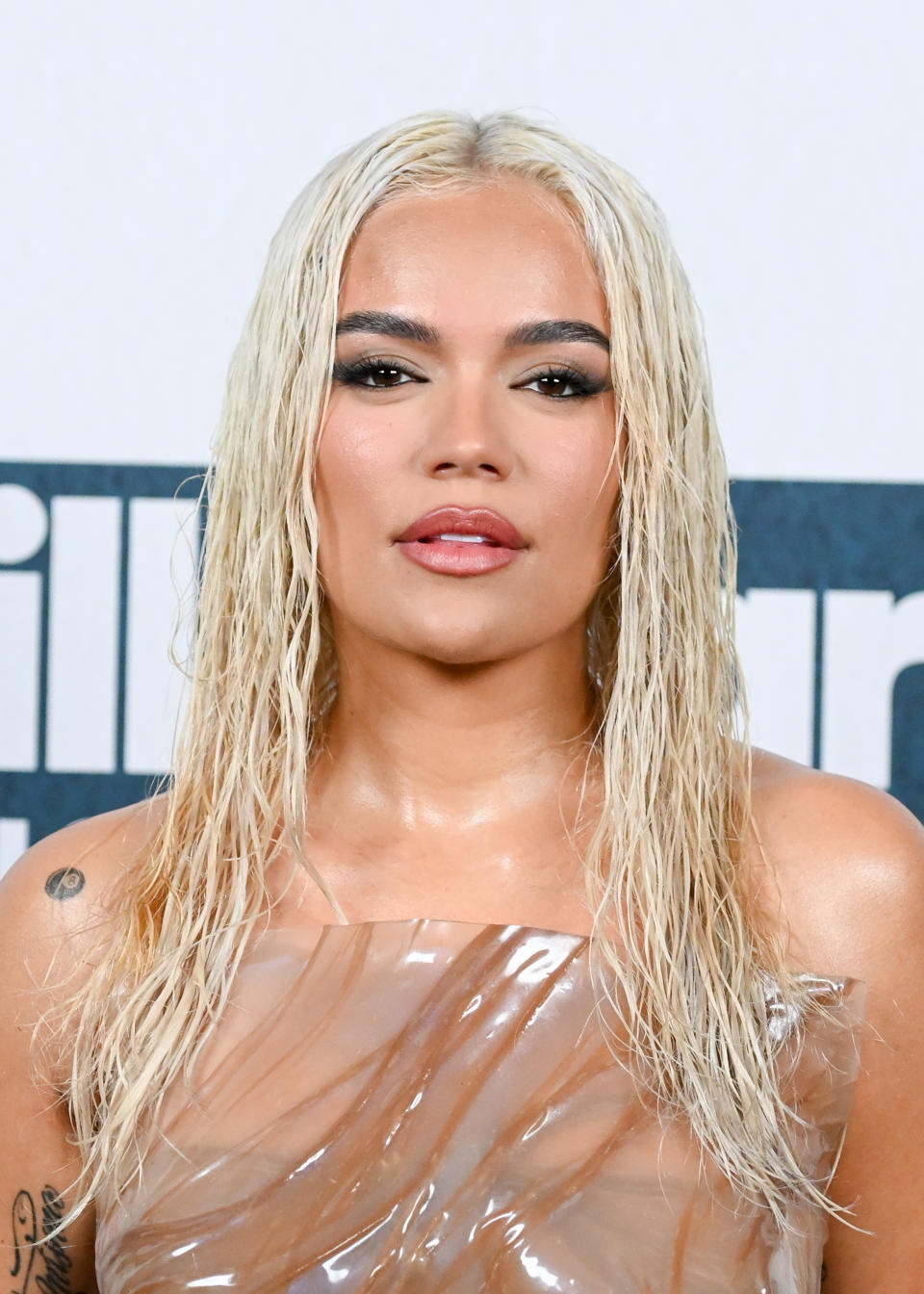 Karol G Wears Wet Look Dress on Billboard Music Awards 2023 Red Carpet