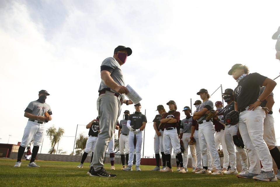 Mar. 8, 2021; Chandler, Arizona, USA; Hamilton's head coach Mike Woods talks with his team during practice at Hamilton High School. Mandatory Credit: Patrick Breen-Arizona Republic