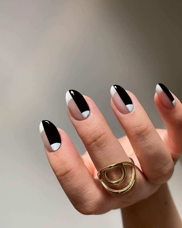 <p>Half <a href="https://www.cosmopolitan.com/style-beauty/beauty/news/a55219/the-french-tip-spring-nail-trend-that-isnt-basic/" rel="nofollow noopener" target="_blank" data-ylk="slk:French manicure;elm:context_link;itc:0;sec:content-canvas" class="link ">French manicure</a>, half half-moon nails, this black-and-white design is <strong>all about pairing opposites together</strong> and looking damn good while doing it. </p><p><a href="https://www.instagram.com/p/B_JM_N-D_I0/?utm_source=ig_embed&utm_campaign=loading" rel="nofollow noopener" target="_blank" data-ylk="slk:See the original post on Instagram;elm:context_link;itc:0;sec:content-canvas" class="link ">See the original post on Instagram</a></p>