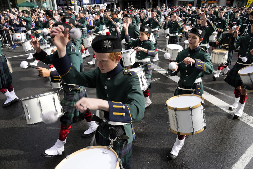 A youth marching band performs during the Anzac Day march in Sydney, Monday, April 25, 2022. Australia and New Zealand commemorate Anzac Day every April 25, the date in 1915 when the Australia and New Zealand Army Corps landed on Turkey in an ill-fated campaign that created the soldiers' first combat of World War I. (AP Photo/Rick Rycroft)