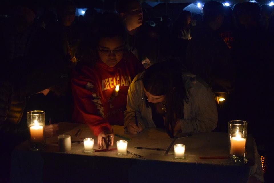 About 200 people gathered at a candlelight vigil for 17-year-old Kyle Kee at Sussex Central High School in Georgetown Friday, Dec. 3, 2021.