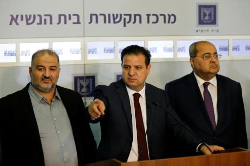 Joint List head Ayman Odeh (C) speaks to the press in the presence of Ahmad Tibi (R) and Mansour Abbas (L) following a meeting with Israel's president