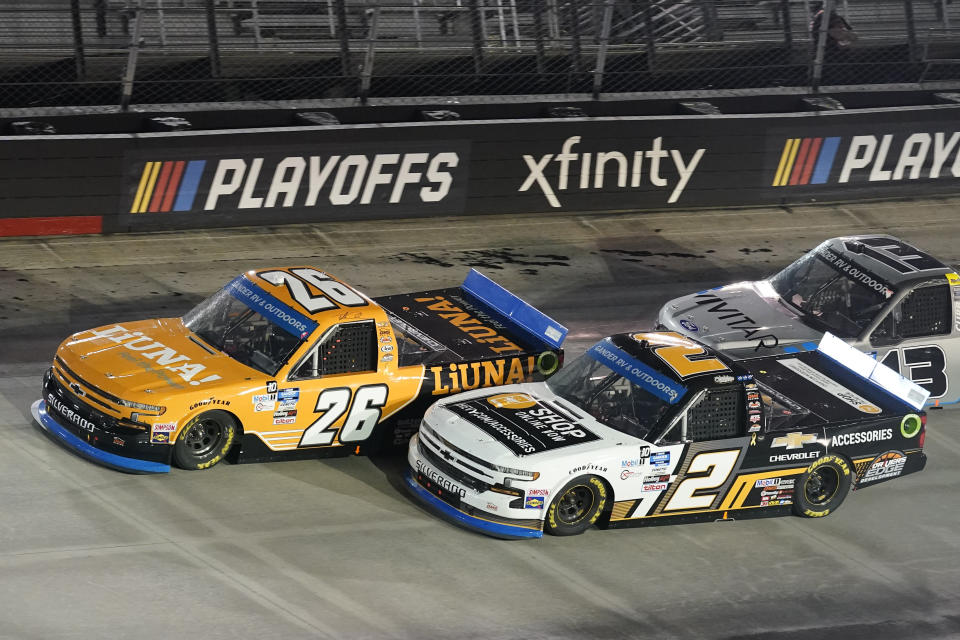 Tyler Ankrum (26) and Sheldon Creed (2) drive into Turn Four during a NASCAR Truck Series auto race Thursday Sept. 17, 2020, in Bristol, Tenn. (AP Photo/Steve Helber)