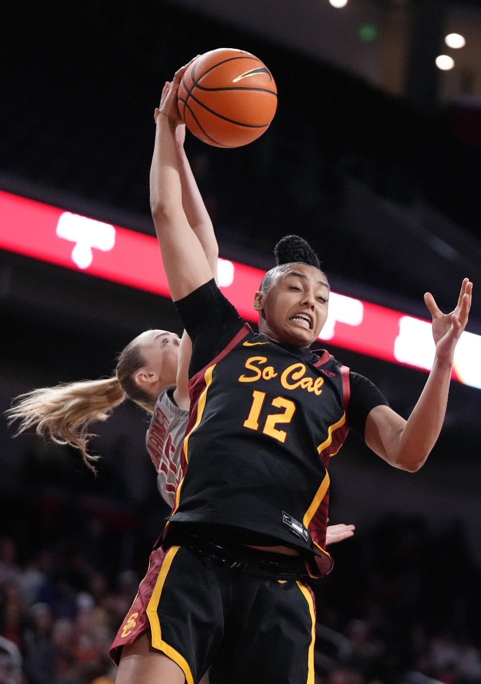 Southern California guard JuJu Watkins, right, grabs a rebound away from Washington State guard Kyra Gardner during the first half of an NCAA college basketball game Friday, Jan. 26, 2024, in Los Angeles. (AP Photo/Mark J. Terrill)