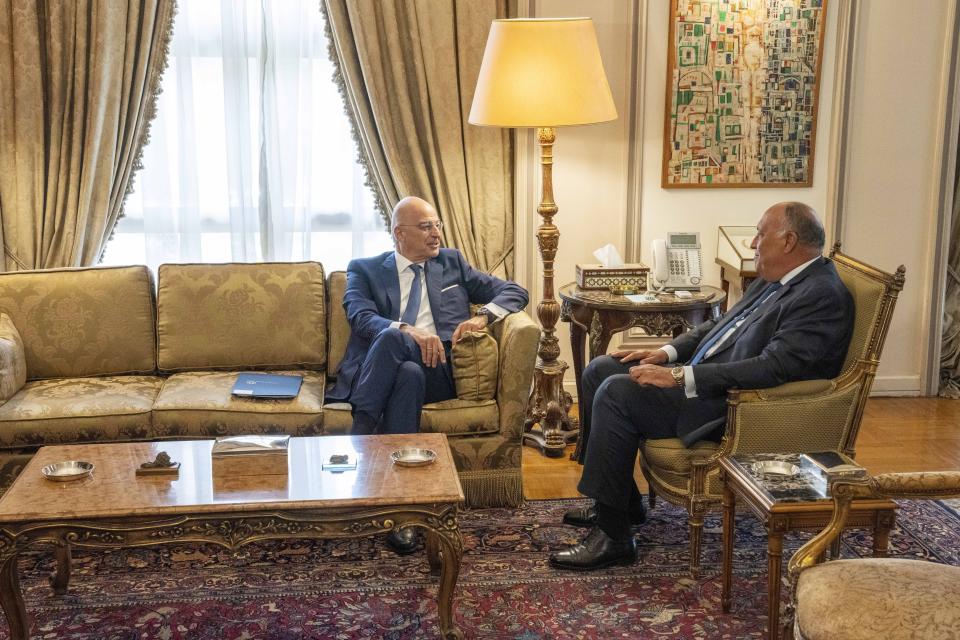 Egyptian Foreign Minister Sameh Shoukry, right, meets with Greek Foreign Minister Nikos Dendias, at the foreign ministry headquarters in Cairo, Egypt, Sunday, Oct. 9, 2022. (AP Photo/Nariman El-Mofty)