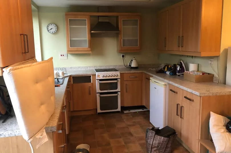 The kitchen before -Credit:SWNS