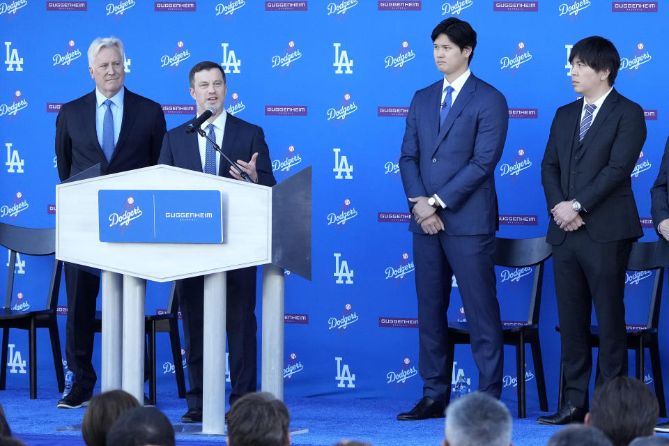 Los Angeles Dodgers baseball operations Andrew Friedman, second from left, speaks in front of owner & chairman Mark Walter, from left, Shohei Ohtani and interpreter Ippei Mizuhara during a baseball news conference at Dodger Stadium Thursday, Dec. 14, 2023, in Los Angeles. (AP Photo/Marcio Jose Sanchez)