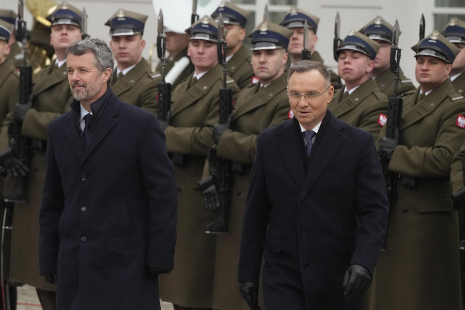 Denmark's King Frederik X, front left, is welcomed by Polish President Andrzej Duda, front right, for a meeting Warsaw, Poland, Wednesday, Jan. 31, 2024. Frederik began his first trip abroad as monarch on Wednesday with a visit to Poland that is focused on promoting Danish business and climate friendly policies. (AP Photo/Czarek Sokolowski)