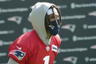 New England Patriots quarterback Cam Newton walks to an NFL football practice, Friday, July 30, 2021, in Foxborough, Mass. (AP Photo/Elise Amendola)