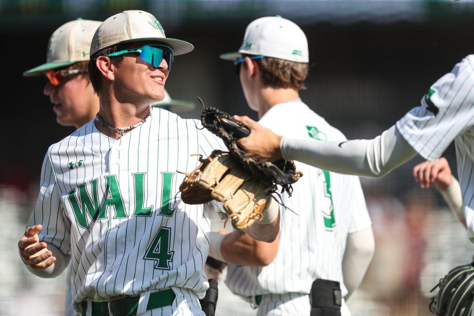 Wall's Matthew Steen high fives teammates after an inning during the Class 3A final on Saturday, June 10, 2023, at Dell Diamond in Round Rock, Texas.