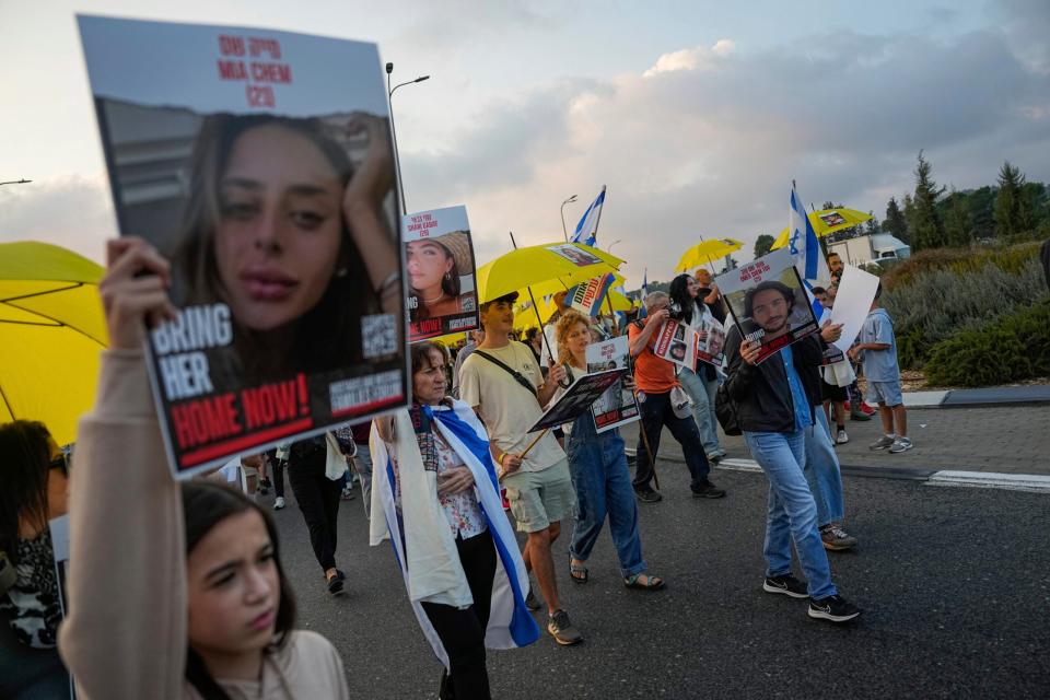 Families and friends of about 240 hostages held by Hamas in Gaza call for their return during a five-day "March for the Hostages" from Tel Aviv to the Prime Minister's Office in Jerusalem, near the town of Abu Ghosh, Israel, Friday, Nov. 17, 2023. (AP Photo/Ohad Zwigenberg)