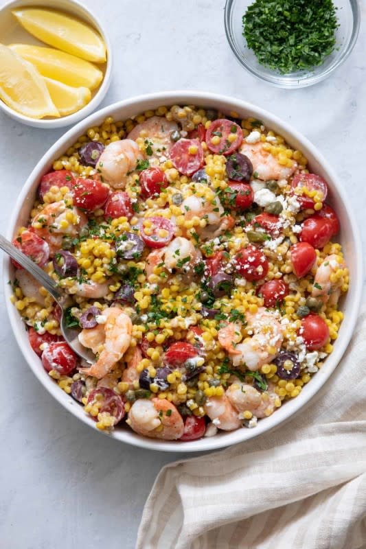 <p>Feel Good Foodie</p><p>A quick and easy summer recipe, this Mediterranean couscous dish is made with shrimp, tomatoes, feta, olives and capers for an irresistible lunch or dinner option.</p><p><strong>Get the recipe: <a href="https://feelgoodfoodie.net/recipe/mediterranean-couscous/" rel="nofollow noopener" target="_blank" data-ylk="slk:Mediterranean Couscous with Shrimp;elm:context_link;itc:0;sec:content-canvas" class="link ">Mediterranean Couscous with Shrimp</a></strong></p>