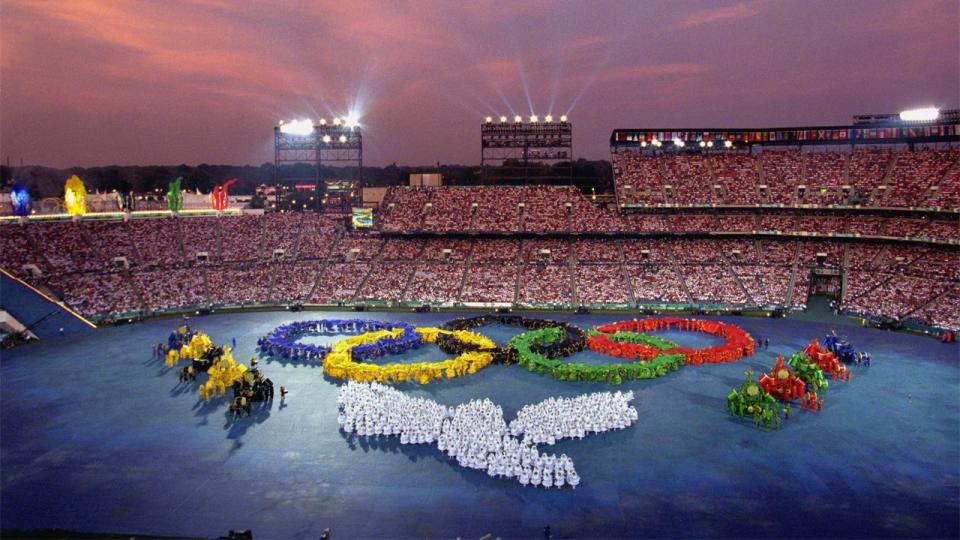 <p>Performers form the Olympic Rings during the Opening Ceremonies of the 1996 Olympic Games on July 19, 1996 at Olympic Stadium in Atlanta, Georgia.</p>