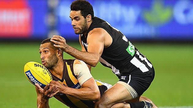 The Hawks and the Pies lock horns on Sunday. Pic: Getty