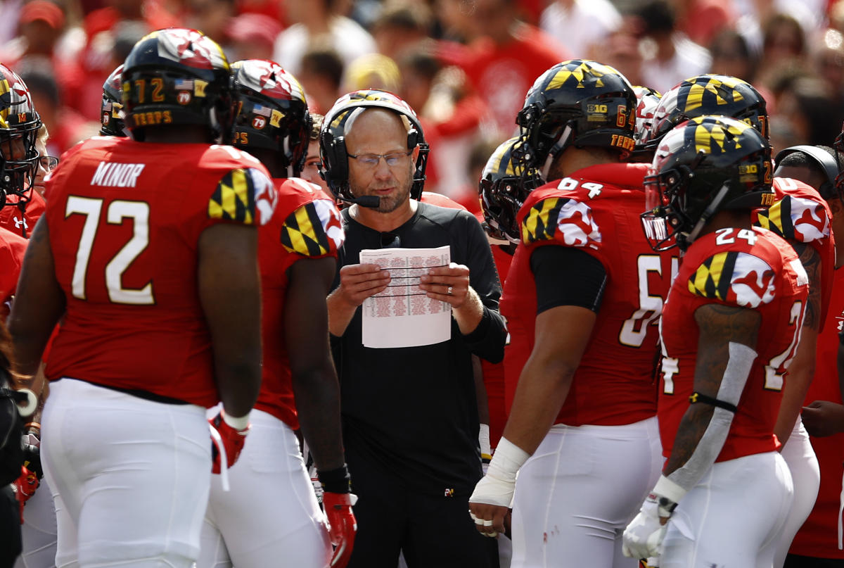 The UMD Football Team Comes Together to Kick a Booster Off a Plane