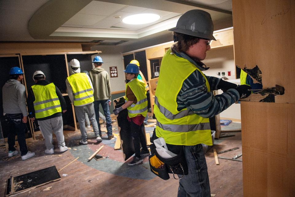 Poudre High School students help with demolition in maternity rooms at Poudre Valley Hospital in Fort Collins on Oct. 31. This is part of a geometry in construction class at Poudre High that helps prepare students for careers in the construction industry and other trades.