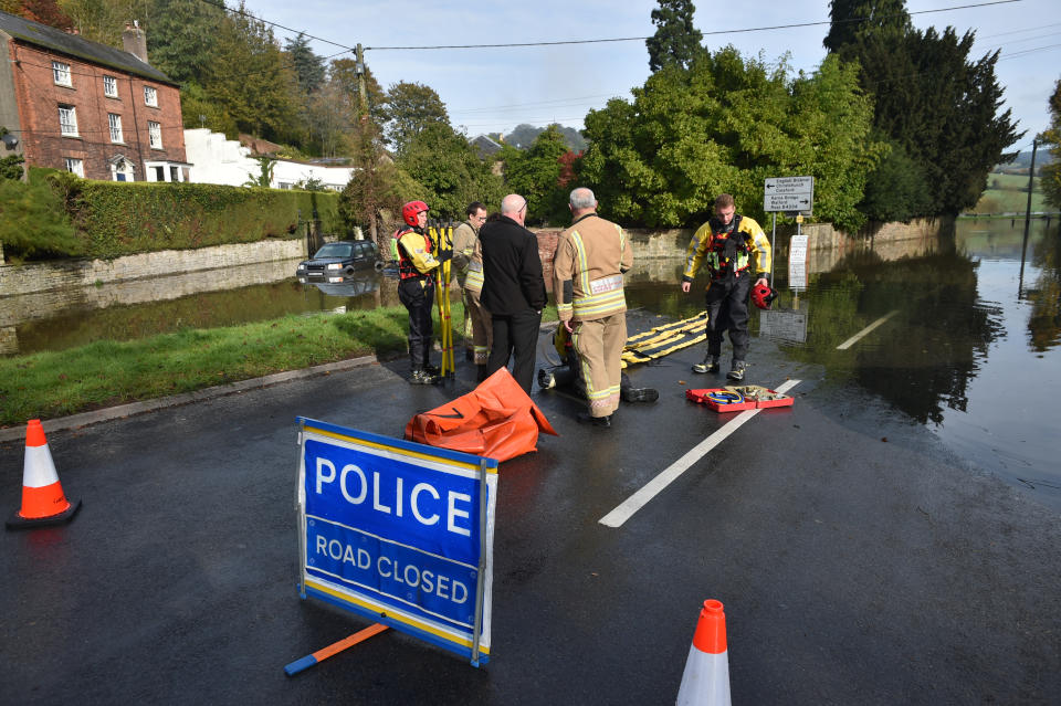 Members of Gloucestershire Fire & Rescue Service, in Lower Lydbrook, Gloucestershire, as they prepare to enter flood water from the River Wye which has flooded parts of the village. (Photo by Ben Birchall/PA Images via Getty Images)