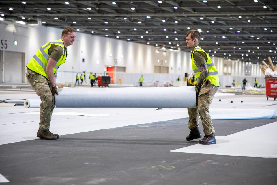 Soldiers from 1 Royal Anglian Regiment assist with the build of the hospital.