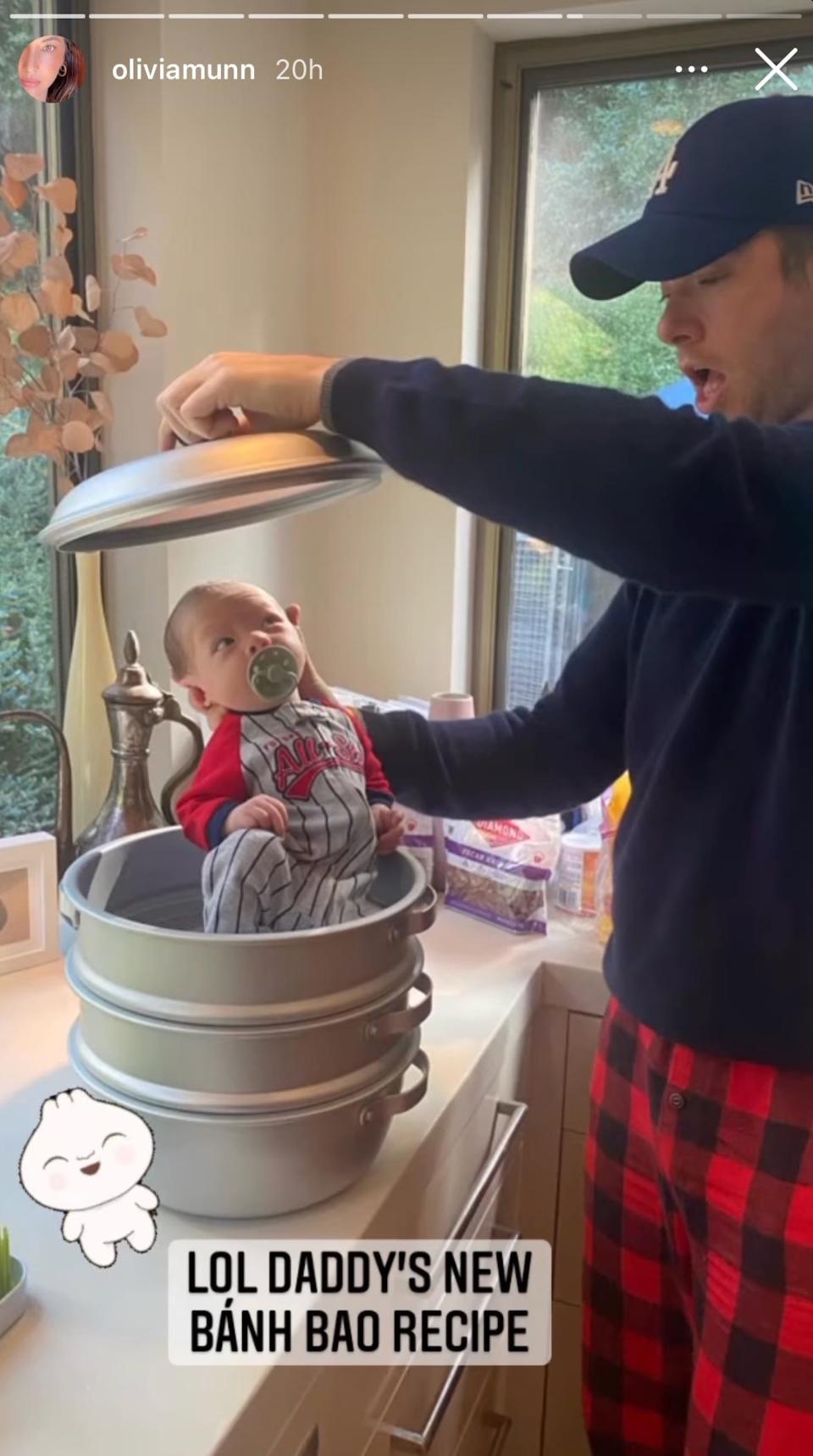 John Mulaney holds his son in a pot in a photo from Olivia Munn's Instagram story.