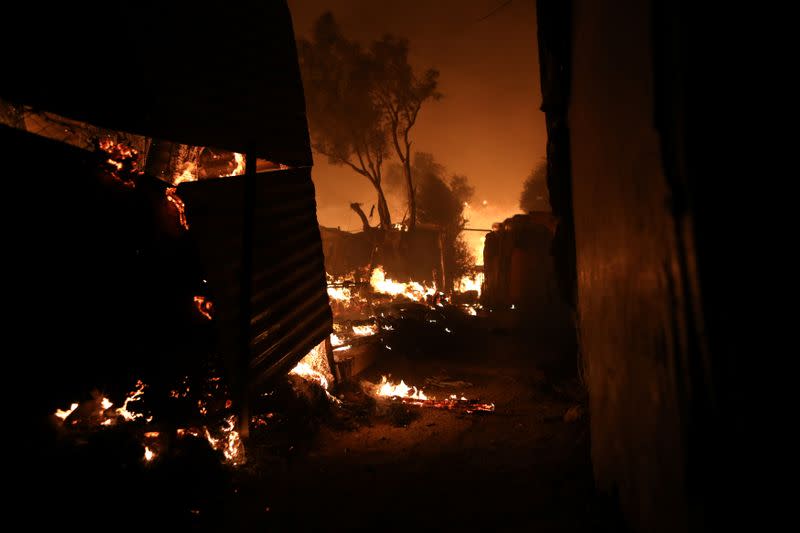 Flames rise as a fire burns at the Moria camp for refugees and migrants on the island of Lesbos