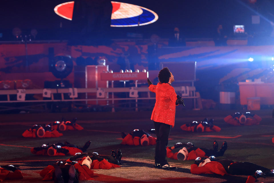 <p>TAMPA, FLORIDA - FEBRUARY 07: The Weeknd performs during the Pepsi Super Bowl LV Halftime Show at Raymond James Stadium on February 07, 2021 in Tampa, Florida. (Photo by Mike Ehrmann/Getty Images)</p> 