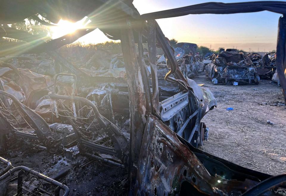 PHOTO: A burnt-out car stands in the setting sun near Netivot, Israel, one of hundreds like it that were recovered from the scene of the deadly Supernova music festival massacre. (Becky Perlow/ABC News)