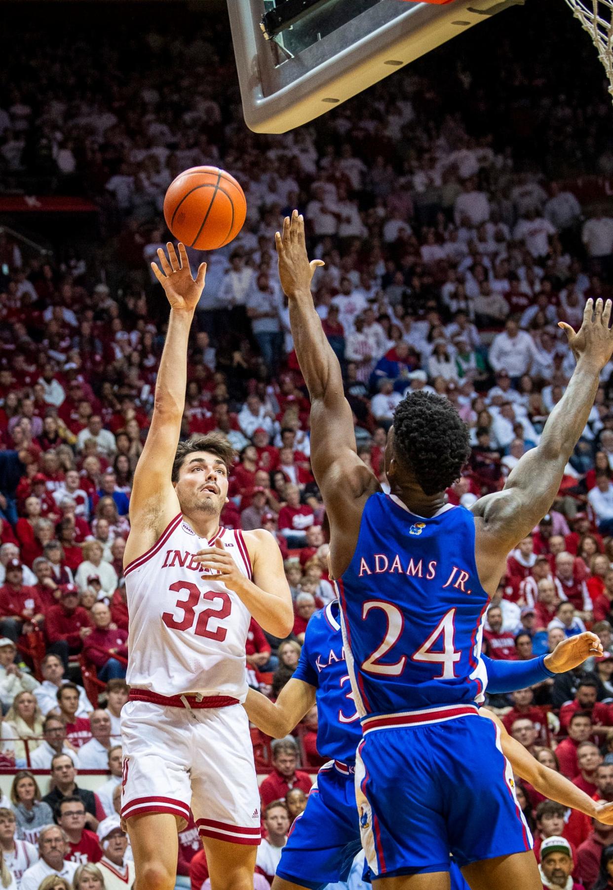 Indiana's Trey Galloway (32) shoots over Kansas' KJ Adams Jr. (24) during the second half of the Indiana versus Kansas men's basketball game at Simon Skjodt Assembly Hall on Saturday, Dec. 16, 2023.