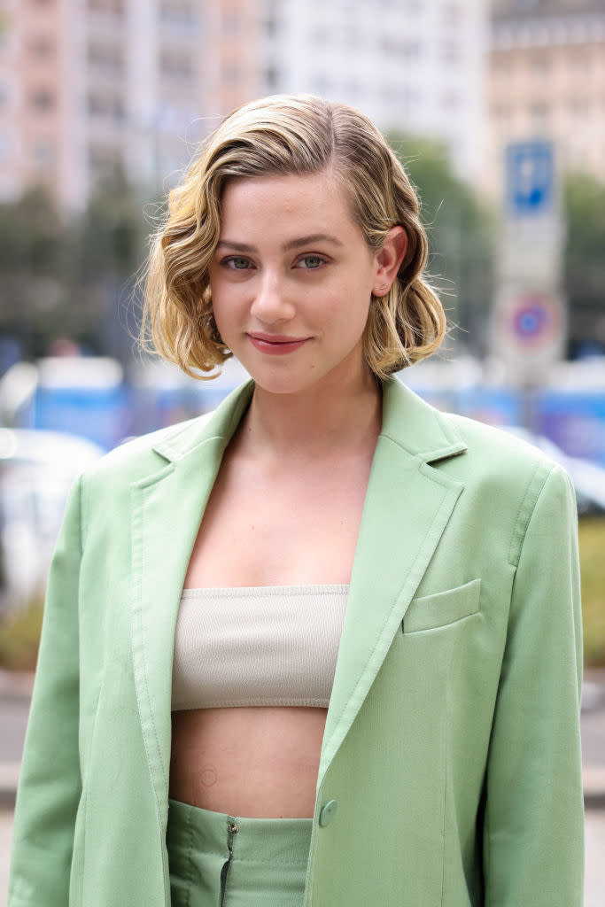 Close-up of Lili in a bandeau top and jacket