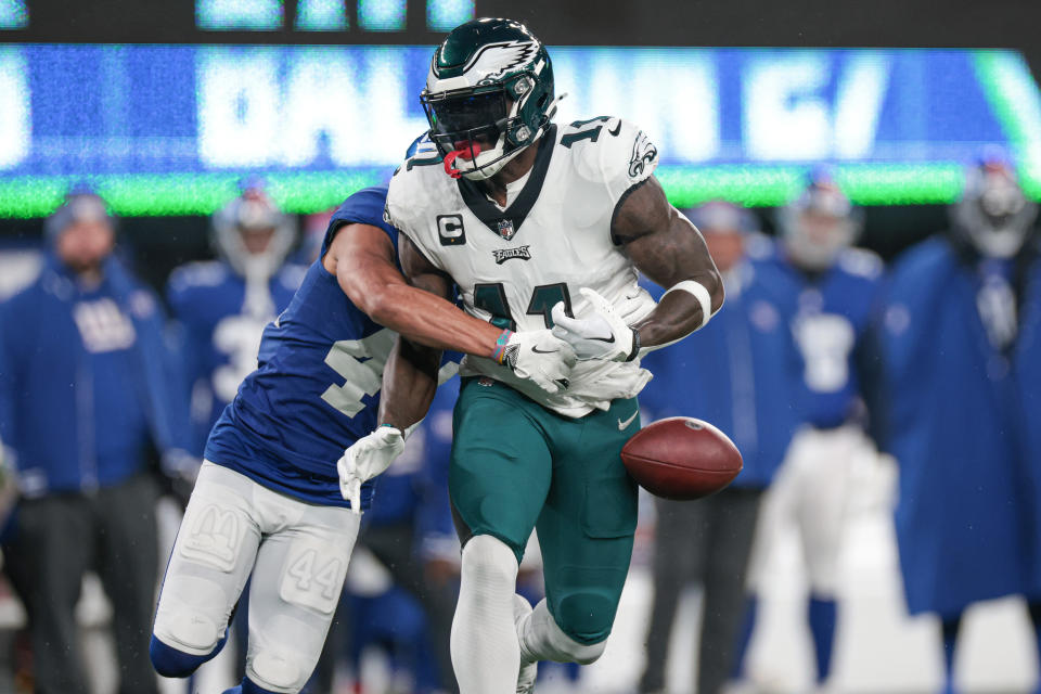 Jan 7, 2024; East Rutherford, New Jersey, USA; New York Giants cornerback Nick McCloud (44) forced a fumble by Philadelphia Eagles wide receiver A.J. Brown (11) during the first quarter at MetLife Stadium. Mandatory Credit: Vincent Carchietta-USA TODAY Sports