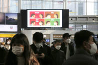A screen shows precautions against the coronavirus at the Seoul Railway Station in Seoul, South Korea, Saturday, Nov. 7, 2020. The Korean letters read "Defenseless, danger and safety" (AP Photo/Ahn Young-joon)