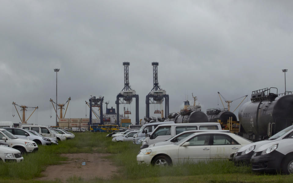 In this Sept. 30, 2013 photo, newly imported used-cars wait to clear customs at Thilawa port, east of Yangon, Myanmar. Online car sales may also be booming. There’s no official data, but over a dozen such websites are operating. There’s huge room for growth in a country of over 60 million with only 38 vehicles per 1,000 people. That’s far less than the U.S., where the ratio is 800 per 1,000 people, or even China, where it’s 60 per 1,000. (AP Photo/Gemunu Amarasinghe)