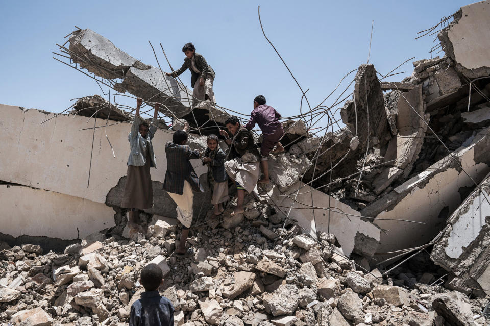 <p>Aal Okab School, Saada City, Yemen, April 24, 2017: Young students play in the ruins of the Aal Okab school, destroyed during the conflict in June 2015. Students now attend lesson in UNICEF tents nearby. (Photograph by Giles Clarke for UN OCHA/Getty Images) </p>