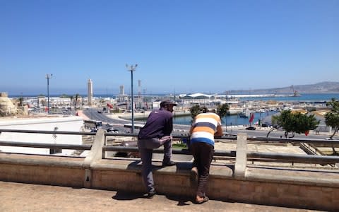 Migrants look out over the Spain-Morocco crossing - Credit: Joe Wallen