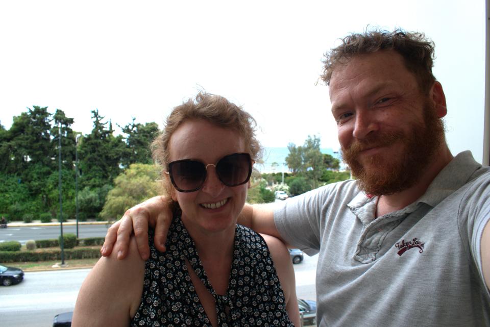 the writer and her husband taking a selfie in front of trees