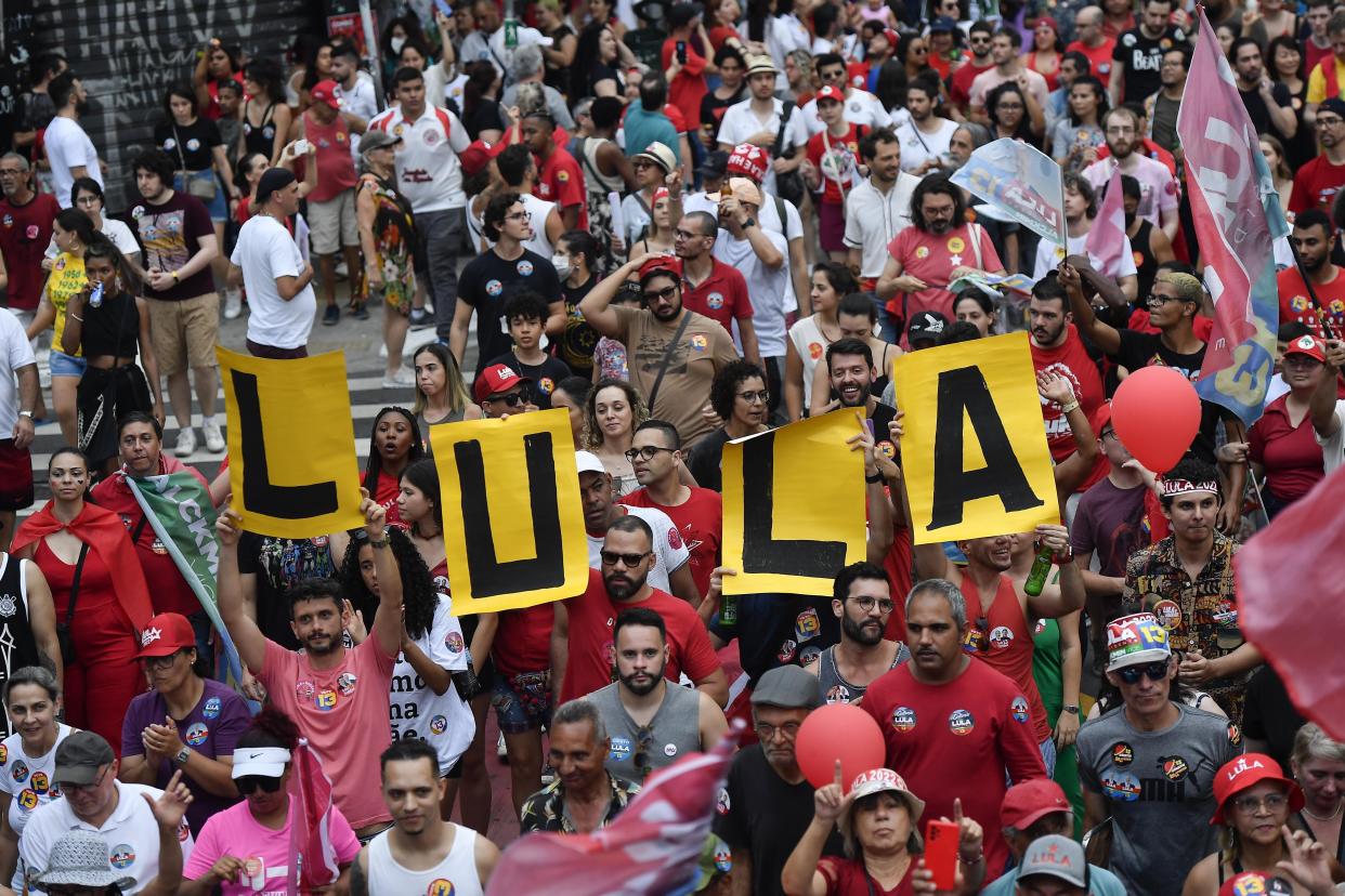 Supporters of former President Luiz Inacio Lula da Silva attend a campaign rally in Sao Paulo, Brazil, Saturday, Oct. 29, 2022. On Sunday, Brazilians head to the voting booth again to choose between da Silva and incumbent Jair Bolsonaro, who are facing each other in a runoff vote after neither got enough support to win outright in the Oct. 2 general election. (AP Photo/Matias Delacroix)