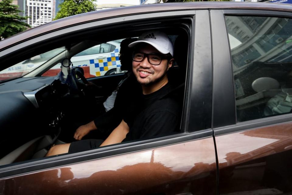 Haziq Abdullah Abdul Aziz is pictured leaving the Dang Wangi police station in Kuala Lumpur July 23, 2019. ― Picture by Ahmad Zamzahuri