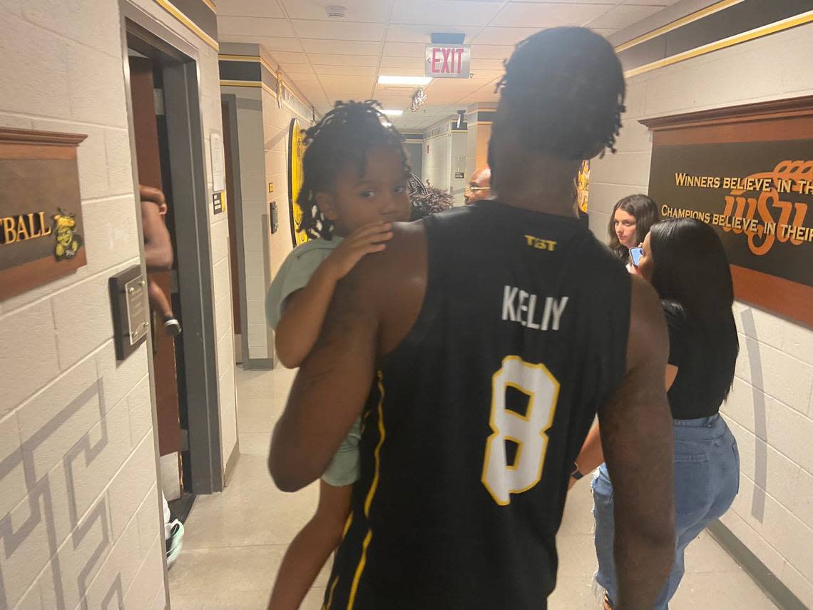 Rashard Kelly carries his son to the locker room following the AfterShocks’ dramatic victory over Gutter Cat Gang on Wednesday. “We need to get you some tuition money,” he told his son before leaving for Dayton two wins away from the $1 million prize.