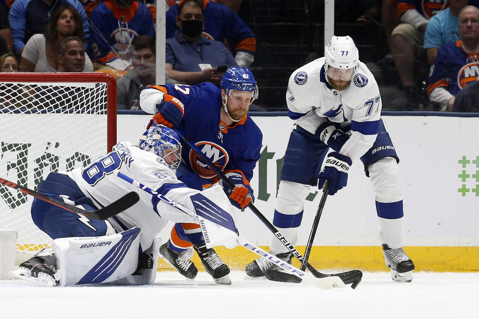 Tampa Bay Lightning goaltender Andrei Vasilevskiy (88) and defenseman Victor Hedman (77) defend the net against New York Islanders right wing Leo Komarov (47) during the first period of Game 4 of an NHL hockey Stanley Cup semifinal, Saturday, June 19, 2021, in Uniondale, N.Y. (AP Photo/Jim McIsaac)