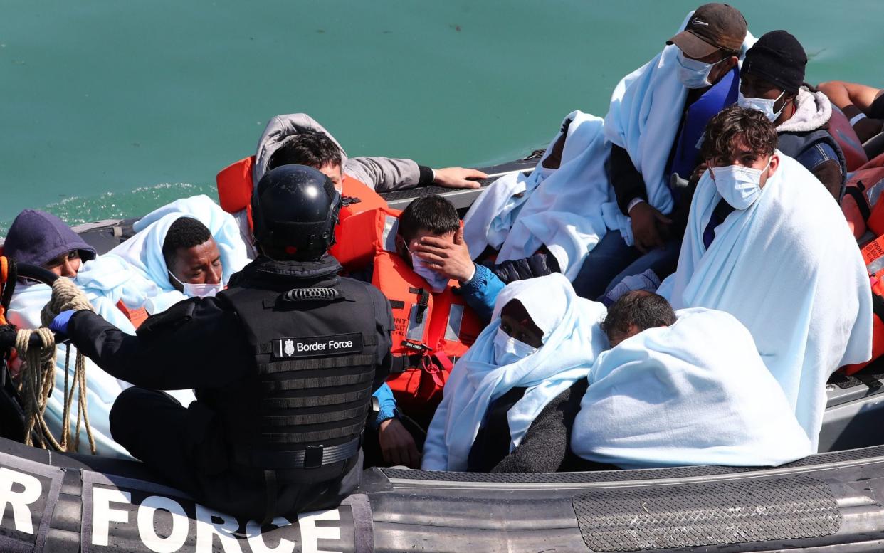 A group of people thought to be migrants are brought in to Dover on Sunday following a small boat incident in the Channel - Gareth Fuller/PA